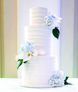 3 tier wedding cake with florals