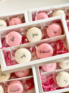 “Will you be my bridesmaid/maid of honor” proposal macaron set. Packaged in set of 5 with pink crinkle paper